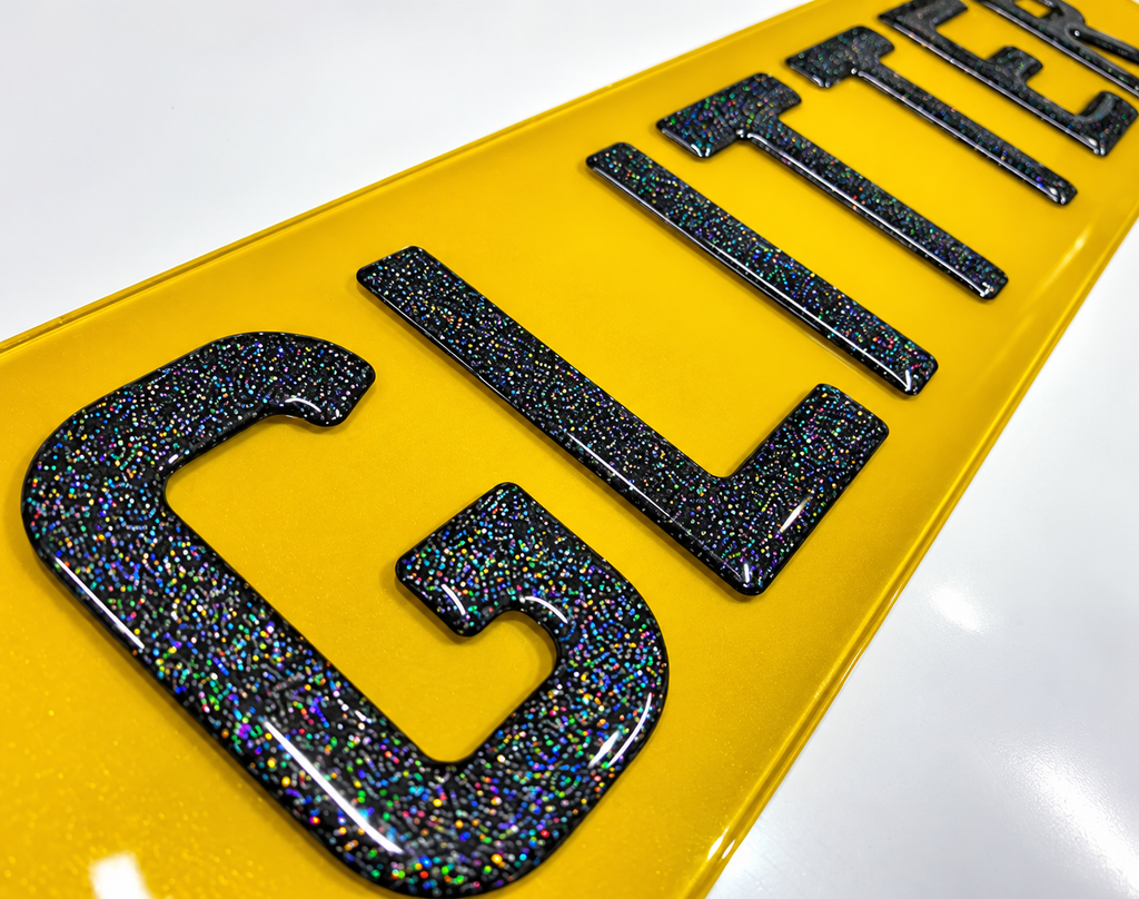 Close-up of Plate Vision glitter gel show plate lettering